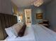 Cozy bedroom with blue walls, ensuite bathroom, and stylish decor elements at 10540 Serenbe Ln, Chattahoochee Hills, GA 30268