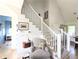 Inviting entryway with a staircase and stylish decor at 10540 Serenbe Ln, Chattahoochee Hills, GA 30268