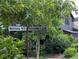 Street view showcasing the street sign for Nestopia Way and Serenbe Lane at 10540 Serenbe Ln, Chattahoochee Hills, GA 30268
