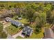Overhead shot of a cozy home surrounded by lush trees, nestled on a well-manicured lot at 1071 N Price Rd, Sugar Hill, GA 30518