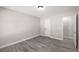Neutral bedroom featuring closet, doorway and ample sunlight at 1071 N Price Rd, Sugar Hill, GA 30518