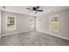Bright, spacious bedroom features updated flooring and large windows at 1071 N Price Rd, Sugar Hill, GA 30518
