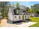A freshly renovated home in a landscaped neighborhood with a long driveway at 1071 N Price Rd, Sugar Hill, GA 30518