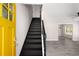 Bright foyer with a stairwell leading to the second floor and views of the living room at 1071 N Price Rd, Sugar Hill, GA 30518