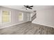 Neutral interior with new floors, fan, light and a view of the front entrance at 1071 N Price Rd, Sugar Hill, GA 30518