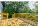 Spacious wooden deck with backyard views and natural light, ideal for relaxation and entertaining at 115 Dahlia Nw Ave, Atlanta, GA 30314