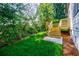 Lush backyard featuring a newly constructed wooden staircase and vibrant green grass at 115 Dahlia Nw Ave, Atlanta, GA 30314