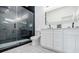 Bathroom with a luxurious glass enclosed shower and double sink vanity at 115 Dahlia Nw Ave, Atlanta, GA 30314