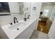 Bathroom featuring a double sink vanity with a quartz countertop and matte black hardware at 115 Dahlia Nw Ave, Atlanta, GA 30314