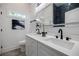 Bathroom with a double sink vanity, modern fixtures, and a stylish tile shower at 115 Dahlia Nw Ave, Atlanta, GA 30314