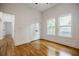 Bedroom boasting hardwood floors, natural light from dual windows, and neutral walls and trim at 115 Dahlia Nw Ave, Atlanta, GA 30314