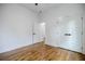 Bright bedroom with hardwood floors, large closet doors, and fresh white paint at 115 Dahlia Nw Ave, Atlanta, GA 30314