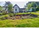Charming remodeled home featuring a lush landscaped front yard with a covered porch at 115 Dahlia Nw Ave, Atlanta, GA 30314