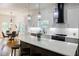 Modern kitchen with white cabinets, black accents, and a spacious island at 115 Dahlia Nw Ave, Atlanta, GA 30314