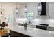 Kitchen featuring sleek countertops, stylish backsplash, and stainless steel appliances at 115 Dahlia Nw Ave, Atlanta, GA 30314
