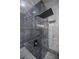 Close-up of a black tiled shower with rainfall shower head at 115 Dahlia Nw Ave, Atlanta, GA 30314