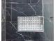 Close-up of a shower niche with marble tile accent at 115 Dahlia Nw Ave, Atlanta, GA 30314
