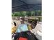 Wooden back deck with a table, chairs, and an umbrella for shade; great for entertaining at 124 Gorham Gates Ct, Hiram, GA 30141
