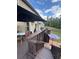 Wooden back deck with stairs, a backyard view, and an open space for entertaining at 124 Gorham Gates Ct, Hiram, GA 30141