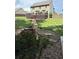 Spacious backyard featuring a lush lawn, deck, and landscaping at 124 Gorham Gates Ct, Hiram, GA 30141