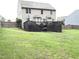 Backyard showcasing a dark wood deck with stairs down to a grill and grassy space with a fence at 124 Gorham Gates Ct, Hiram, GA 30141