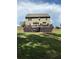 Large backyard featuring a deck, patio, and well-kept lawn at 124 Gorham Gates Ct, Hiram, GA 30141