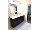Bathroom featuring a dual sink vanity and stylish decor; neutral color palette with natural light at 124 Gorham Gates Ct, Hiram, GA 30141