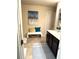 Bathroom featuring a bench, vanity, and stylish decor; neutral color palette with natural light at 124 Gorham Gates Ct, Hiram, GA 30141