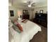 Bright bedroom features a bed, television, and view into bath and hallway at 124 Gorham Gates Ct, Hiram, GA 30141