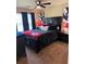 A large bedroom featuring an ornate dark wood bed frame, ceiling fan, and carpeted floors at 124 Gorham Gates Ct, Hiram, GA 30141