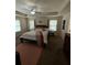 Bedroom featuring ceiling fan and view into windows with natural light at 124 Gorham Gates Ct, Hiram, GA 30141