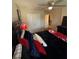 Bedroom featuring ceiling fan, closet doors, and view into hallway and stairway at 124 Gorham Gates Ct, Hiram, GA 30141