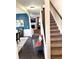 Inviting entryway featuring a staircase, dark wood floors, and stylish decor, creating a warm welcome at 124 Gorham Gates Ct, Hiram, GA 30141