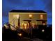 Exterior view of the home at night with illuminated deck and backyard at 124 Gorham Gates Ct, Hiram, GA 30141