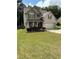 Charming two-story home with a manicured lawn, brick accents, and a welcoming front porch at 124 Gorham Gates Ct, Hiram, GA 30141