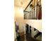 Foyer staircase view looking down with a light-filled entrance and open landing at 124 Gorham Gates Ct, Hiram, GA 30141
