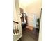 Inviting foyer with dark wood floors, decorative bench, and stylish decor at 124 Gorham Gates Ct, Hiram, GA 30141
