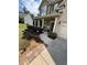 Landscaped front yard with beautiful flower beds and a charming walkway to the front door at 124 Gorham Gates Ct, Hiram, GA 30141