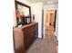 Hallway with dresser and decor, leading to additional rooms in the home with neutral color palette at 124 Gorham Gates Ct, Hiram, GA 30141
