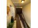 Hallway featuring a staircase, carpeted floors and view of dark barn doors at 124 Gorham Gates Ct, Hiram, GA 30141