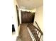 Second floor hallway view with sliding barn doors and dark wood railing at 124 Gorham Gates Ct, Hiram, GA 30141