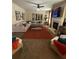 Comfortable living room featuring a fireplace, ample seating, neutral color palette, and an accent rug at 124 Gorham Gates Ct, Hiram, GA 30141