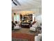 Comfortable living room adjacent to the kitchen, featuring a large area rug and stylish decor at 124 Gorham Gates Ct, Hiram, GA 30141