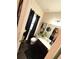 Elegant powder room featuring a modern vanity, black accents, and stylish decor at 124 Gorham Gates Ct, Hiram, GA 30141