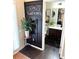 Stylish powder room with a chalkboard accent wall, decorative plant, and modern fixtures at 124 Gorham Gates Ct, Hiram, GA 30141