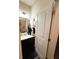 Contemporary powder room with dark wood floors, modern vanity, and elegant fixtures at 124 Gorham Gates Ct, Hiram, GA 30141