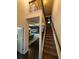 View of carpeted staircase with iron railing leading to the second floor at 124 Gorham Gates Ct, Hiram, GA 30141
