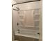 Bathroom features a tub with shower head and tile surround at 1807 Ashborough Se Cir # B, Marietta, GA 30067