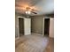Bedroom features a ceiling fan, neutral walls, and closet storage at 1807 Ashborough Se Cir # B, Marietta, GA 30067