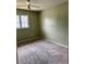 Empty bedroom with a ceiling fan and a window with natural light at 1807 Ashborough Se Cir # B, Marietta, GA 30067